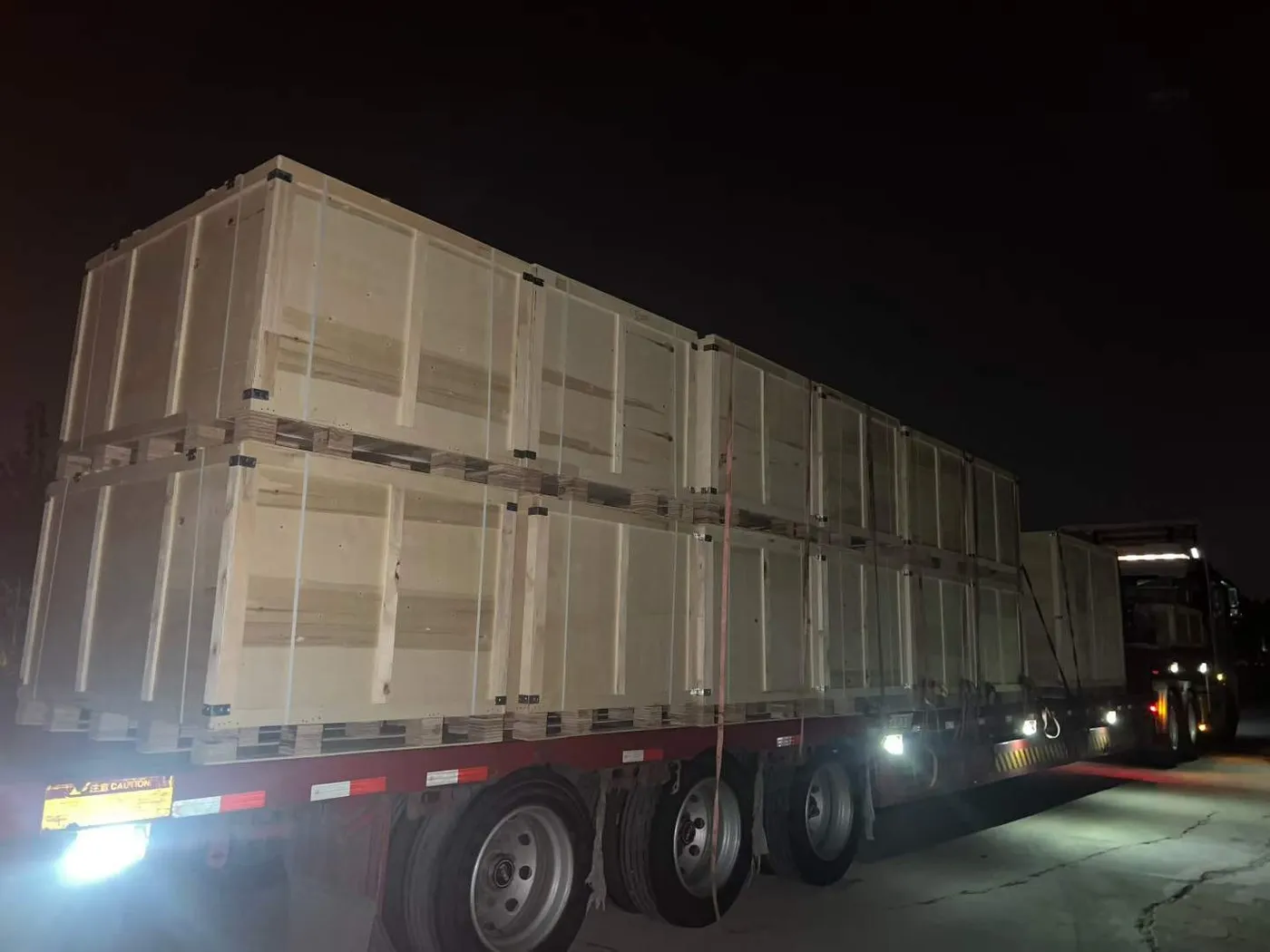 Wooden crates of Raymon equipment strapped on a truck for export delivery
